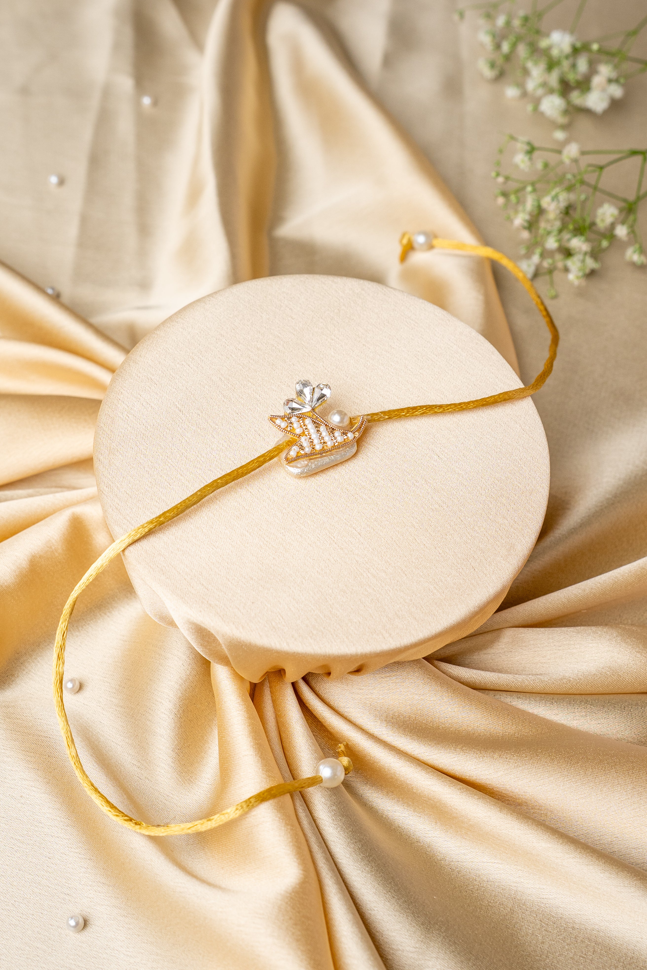 pearl and work butti rakhi
