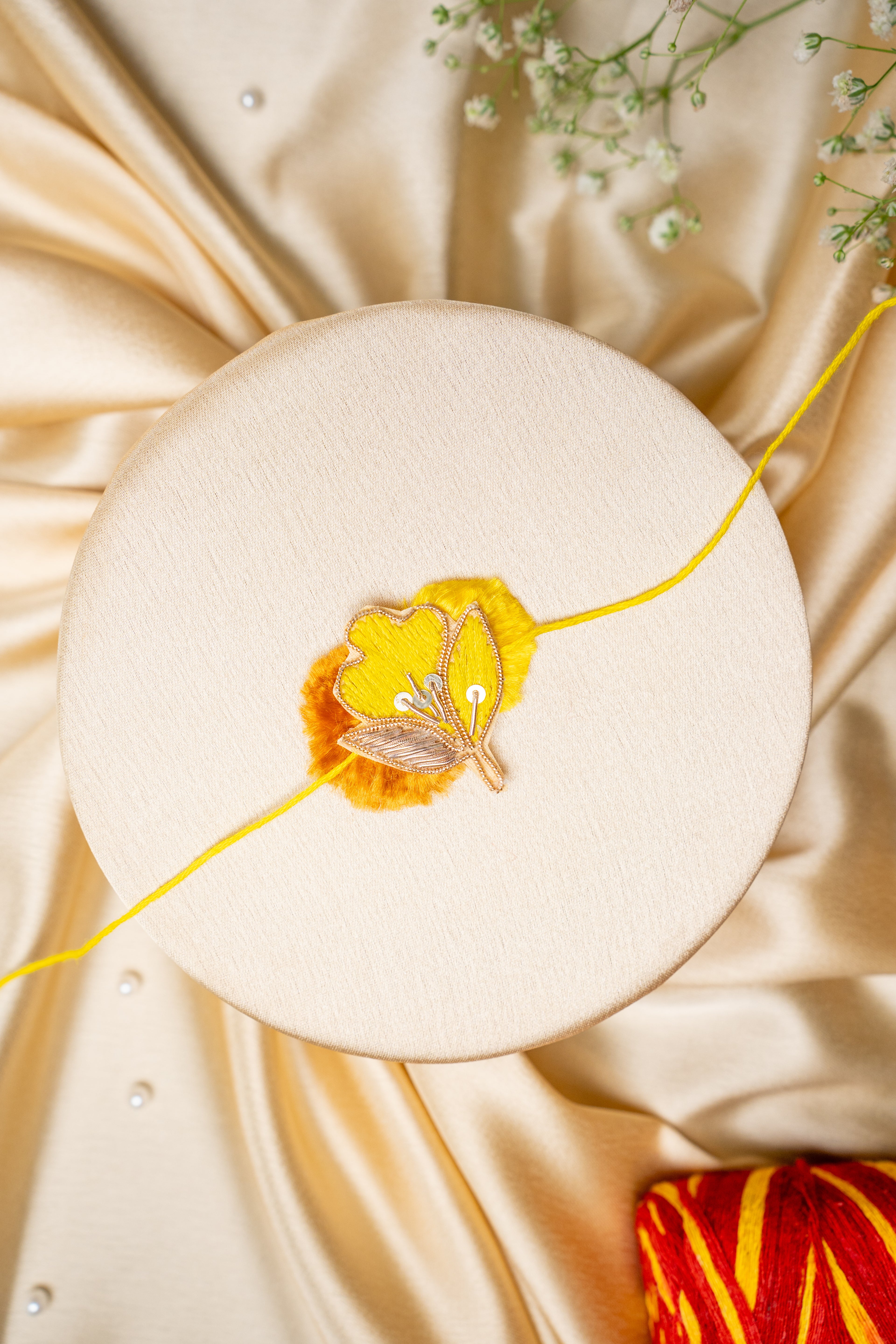 Yellow traditional butti rakhi