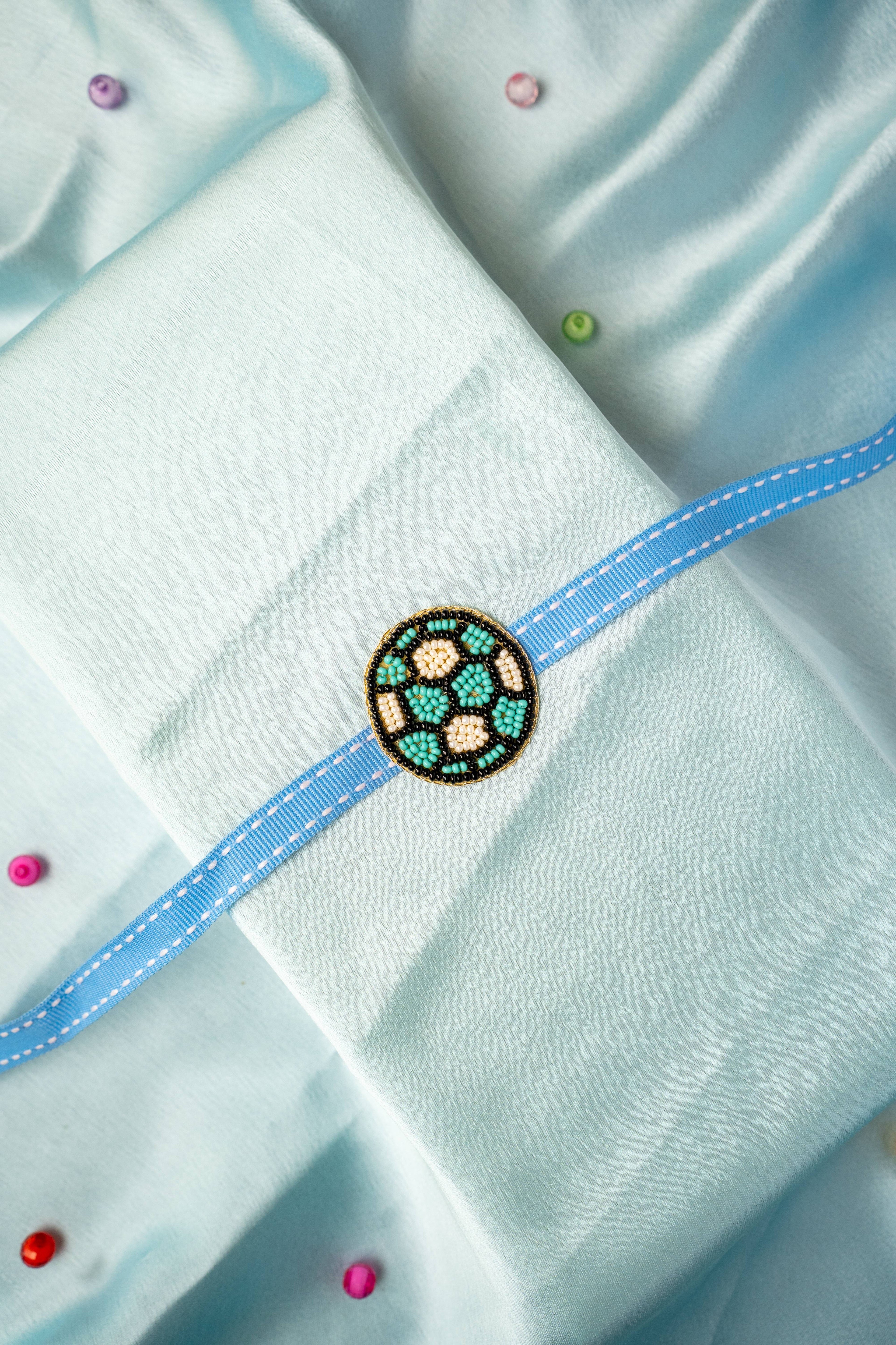 Beadwork patch football rakhi